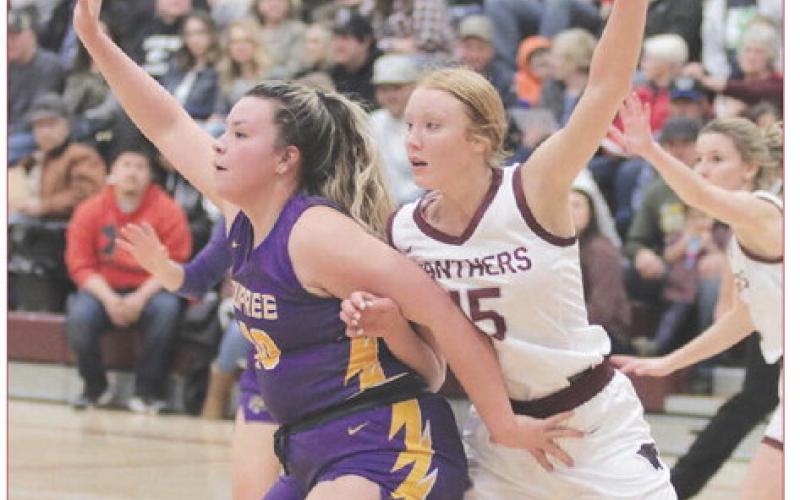 Dupree senior center Rylin Rousseau (left) battles with Timber Lake junior Kendyl Locken for post position during non-conference girls basketball action last week. Dupree went on a 16-10 run in the fourth quarter to seal a 50-42 victory. Photo by Jon Flatland
