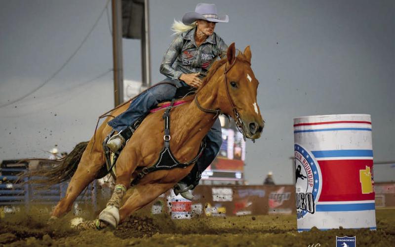 Summer Kosel of Glenham guides her horse around a barrel at the Killdeer Mountain Round-Up Rodeo held July 1-4 in Killdeer, SD. Kosel placed 13th in Killdeer but bounced back to win the barrel racing championship at the Sitting Bull Stampede Rodeo in Mobridge July 3-4. Photo courtesy of Chuck Miner/4C Photography