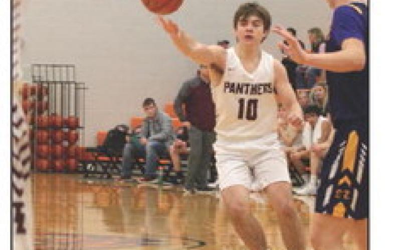 Defense was a key to the Timber Lake Panthers’ win over Strasburg-Zeeland on Saturday, Dec. 16, at the Mobridge Rotary Classic. Above, Cole Ducheneaux (12), Kody Keller (1), Gracen Hansen (4( and Tristan Dupris (11) converge on a Clipper player to force a turnover. Right, point guard Treyden Beer passes to the wing on the offensive end of the floor.