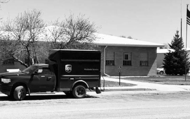 A United Parcel Service (UPS) truck sits in front of the Dewey County Courthouse in Timber Lake on Tuesday, May 2, while the driver delivers a package inside. As of Monday, May 1, UPS cut its deliveries to rural West River communities from five days to three days per week. The communities of Timber Lake, Isabel, Dupree, and Eagle Butte are among those affected by the cuts. Photo by Jon Flatland