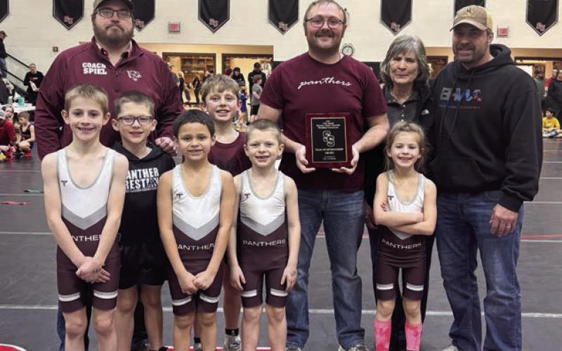 The Timber Lake Youth Wrestling Team was presented the Don Vorhees Sportsmanship Award at the Brandon Delzer Memorial Wrestling Tournament held Saturday, Jan. 11, in Sturgis. Team members are (l-r) Crawford Maher, Lincoln Aberle, Wilson Wiedmer, Vern Long (middle) Trevor Aberle and Rowan Maher; (back) Coaches Travis Spiel and Sawyer Sandquist along with members of the Vorhees family.