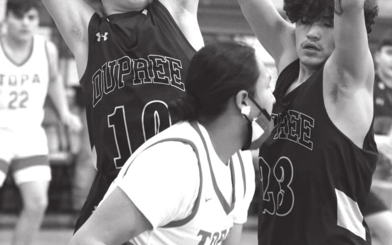 Dupree’s Klayte McLellan (10) and Ted Eagle (23) trap Tiospaye Topa’s Manuel Swan during their LMC tournament contest. Photos by Jon Flatland