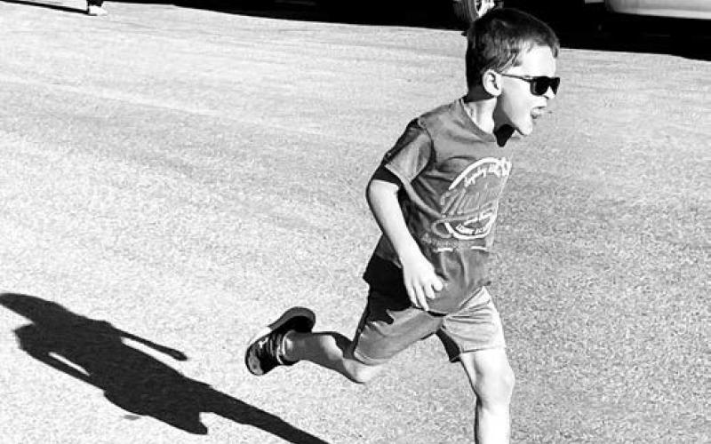 Lincoln Aberle ran the “round the block” race for kids 10 and under.
