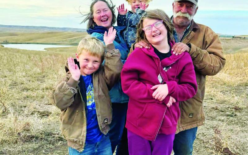 Arden and Lori Petersen with their on-ranch grandkids.