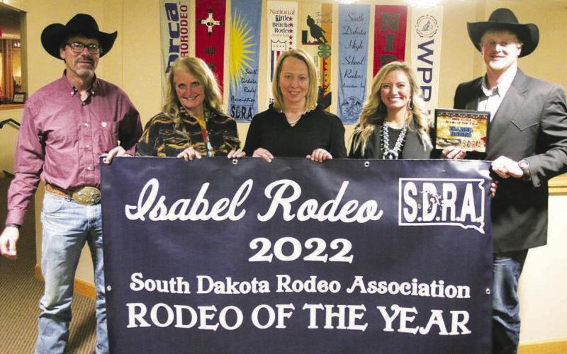 Accepting the honor ... Members of the Isabel Rodeo Association were on hand at the Casey Tibbs Rodeo Center in Ft. Pierre on Saturday, Feb. 11, to receive the South Dakota Rodeo Association’s award for 2022 Rodeo of the Year. Accepting the award and banner were (L-R) board members David and Kristi Alley, and Merretta Anderson, Bailey Alley, and Isabel Rodeo Association President Lane Alley. For more on the annual SDRA awards, see Page 11.