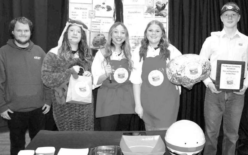 The cast and crew for Dupree’s One Act Play Fast Food (L-R) Kylund McGill (lighting), Gabby De La Rosa (chicken, granny, and new employee), Zoey De La Rosa (immature Patty, germophobe date, and customer stealing), Trinity Leithauser (immature Pat and sunshiny employee working many shifts), and Garrick Dekle (young manager and first time date). Photo by Patty Peacock