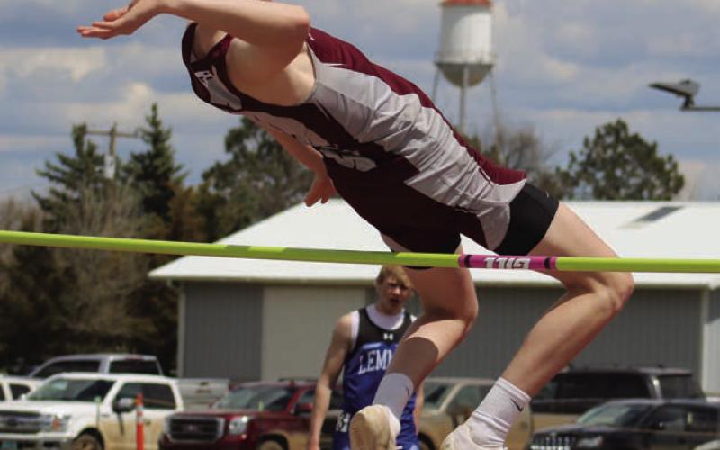 Senior Kyler Bollinger clears the bar at 5-8, a personal best, to win the high jump crown at this year’s Little Moreau Conference Track Meet held last Thursday, May 9, at Kraft Field in Timber Lake.