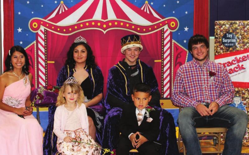RIGHT: Queen Amiyah Bridwell and King Cinch Hebb with first runners-up Megan Hinrichs and Hunter Stambach and Elementary Princess Jersie Deal and Prince London Garreau