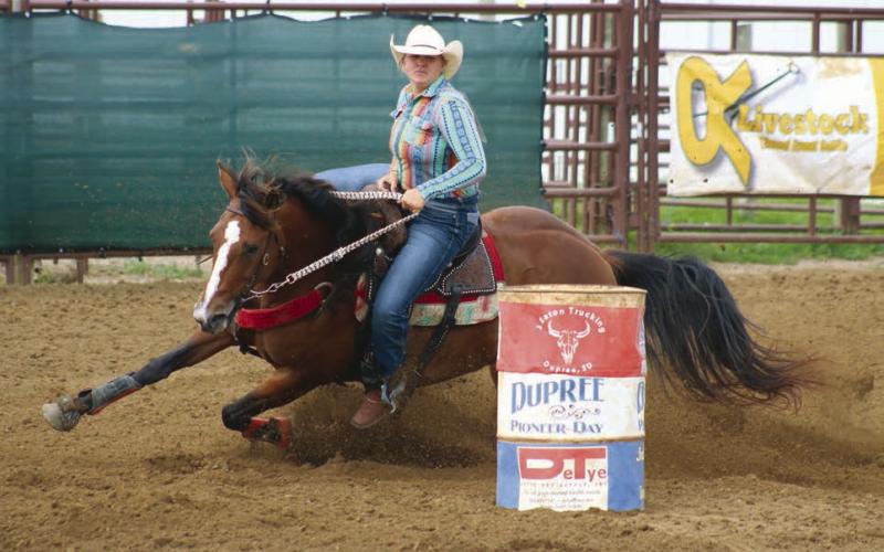 Hope Kiel of Glenham horse dips her horse around a barrel during the Senior Girls Barrels event at the 64th annual Ziebach County 4-H Rodeo in Dupree on Saturday, July 13. A second day of competition was cancelled due to storm damage at the Dupree Rodeo Grounds. Check out the Topic Facebook page for more Jr. and Sr. Girls Barrels and Poles photos. Photo by Jon Flatland