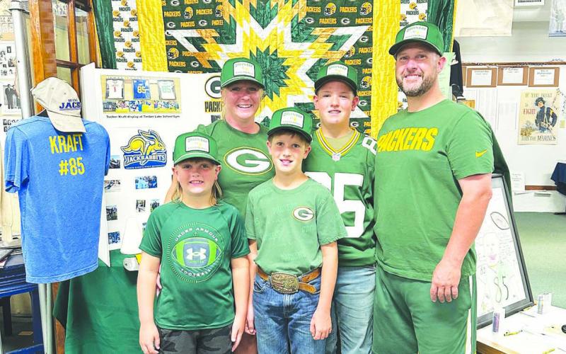 The Krueger family from Arbor Vitae, Wisconsin visited Timber Lake last week to get a look at Tucker Kraft’s hometown. They are friends of Cody and Tracy Maher and Terry Renderneck and were on their way to Yellowstone. They came dressed in Packers attire but stopped at Dakota Image to pick up some more. They saw the Tucker Kraft exhibit at the Museum (above) and had lunch at The Corner Bar &amp;amp; Grill.