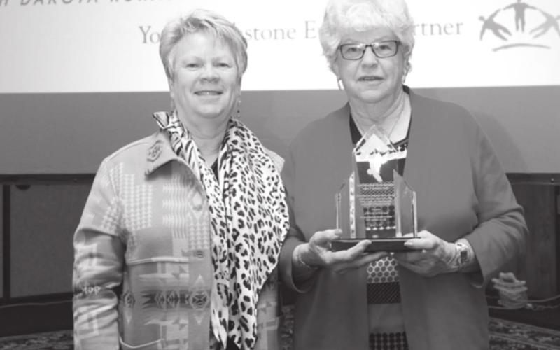 AT RIGHT: Beverly Birkeland with her Legacy of Leadership Award, with Moreau-Grand Manger Melissa Maher (LEFT).