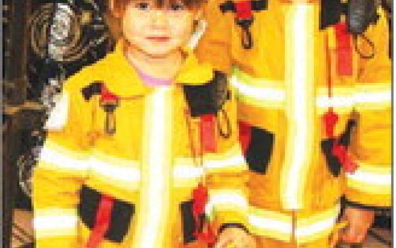 LEFT: The girls as firemen took home the most original prize for kids 6 and under (L-R): Lucy and Charlotte Keegan.