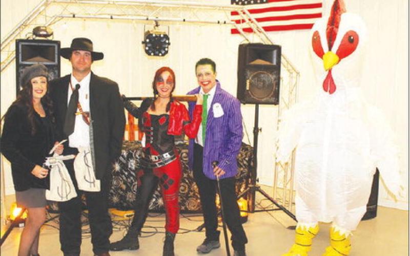 Older people that got in on the fun and dressed up and won prizes were (L-R): Cooper &amp;amp; Makense Wall, Kayla Spiel and Brandon Gilles, and giant chicken Chloe Dupree.
