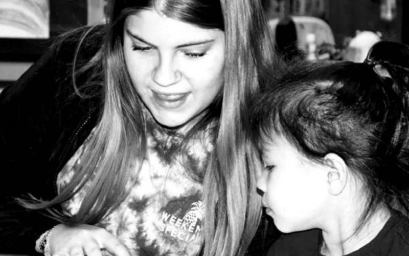 Dupree NHS member Dustilyn Lemke reading to a PreK student