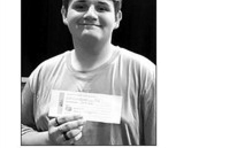 Jesse Ridl, the top seller for the FFA Fruit, Meat, and Cheese Fundraiser received a gift certificate.
