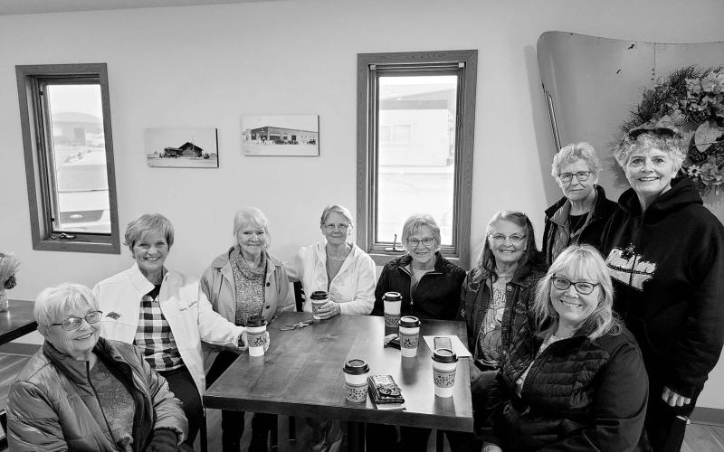 Robin Nannini (FAR RIGHT, FRONT) with the Wednesday morning coffee ladies at Grounded Coffee and Gifts during a visit in October. Others are (L-R) Pat Kjellsen, Audrey Jackson, Barb Gross, Mavis Enright, Janet Gill, Linda Kraft, Jean Tehle, and Kathy Nelson.