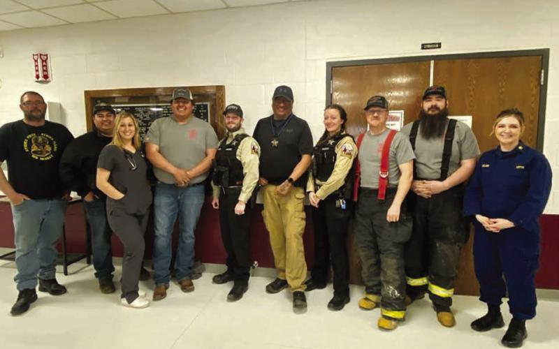 Community heroes honored at Timber Lake Elementary on March 21 included these firefighters, EMTs, law enforcement officers, county road crew, and nurses. L-R: Justin Webb, Will Wiedmer, Rachael Goldade, Keith Jewett, Kyle Nilson, Ash Arpan, Trista Bulit, Brent Gill, Shad Bollinger, and Veronica Handeland.
