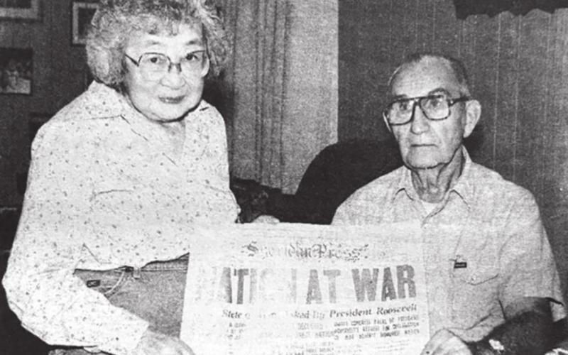 Jim and Mary Byington with the front page of the Sheridan Press