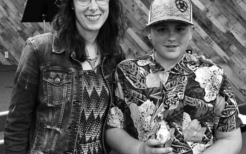 LEFT: Colette Schaffer presented Mason Bickel with the Studio Award. Mason composed and performed an original song, with lyrics.