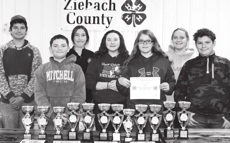 The members of the Friendly Few 4-H Club, advised by Nila Woodward, and the awards they received at Ziebach County 4H Recognition Night. FRONT (L-R): Maverick Lemke, Trinity Leithauser, Wyatt Lemke; BACK: Alan Lemke, Minda Woodward, Sierra Feickert, and Erin Lemke.