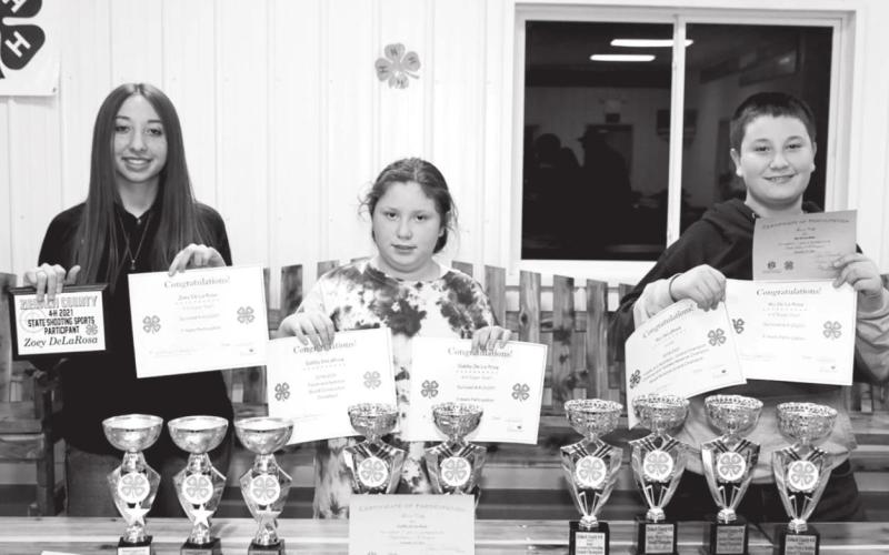 The members of the Mustangs 4H Club, advised by Patty Peacock, with their 2021 awards. (L-R): Zoey, Gabriella, and Rio DeLaRosa.