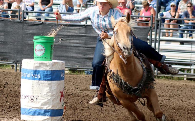 Victory Kosel of Glenham makes a successful pass during the Jr. Girls Flag Race at the SD State 4-H Finals Rodeo in Ft. Pierre on Saturday.