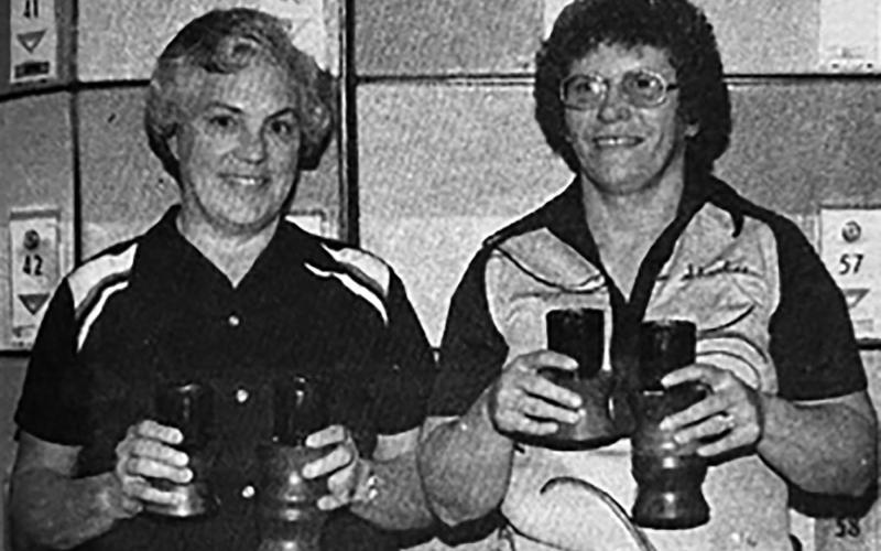 Win 600 Club Tourney Vickie Stanek of Timber Lake (LEFT)and Sharlene Schaffer of Isabel won first place in the 600 Club Bowling Tournament held October 9 at Pierre. They were awarded candlestick trophies and a cash prize of $174.67 for their score of 1276 in the women’s doubles. Sharlene also placed in the women’s singles, ranking with an 810. Timber Lake Topic, November 18, 1982