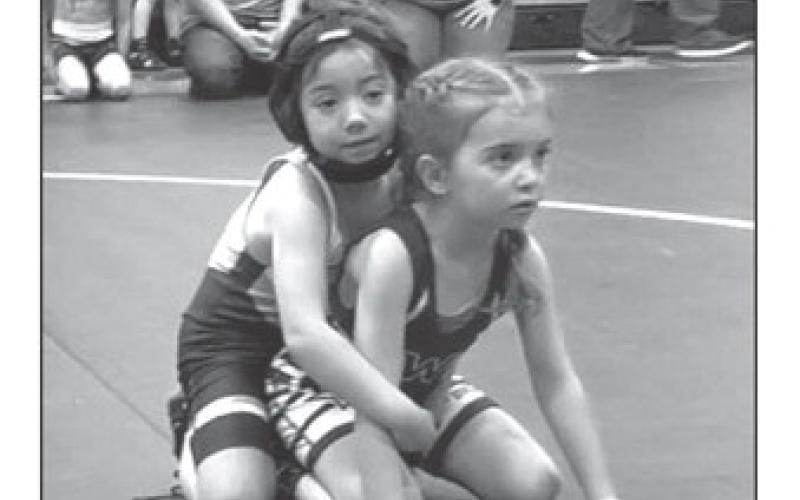 Ramzi Veit, left, was among the gold medal winners at the Mobridge Youth Wrestling Invitational held Sunday, Feb. 11. Ramzi took top honors in the Girls Tots 38-39 division. Eight member of the Timber Lake Youth Wrestling Club earned top spots on the winners podium. Courtesy Photo