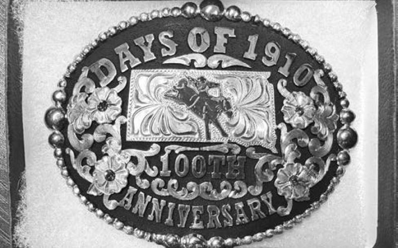 This Days of 1910 buckle from Timber Lake’s 100th anniversary will be auctioned off by the Timber Lake Rodeo Association on Thursday, July 23 during this year’s Days of 190 festivities. The TLRA and Western Dakota Bank are sponsoring the free supper beginning at 5:30 in the tent, and the auction of 4-H cookies and pies and the 100th anniversary buckle will follow, just before the annual talent show begins.