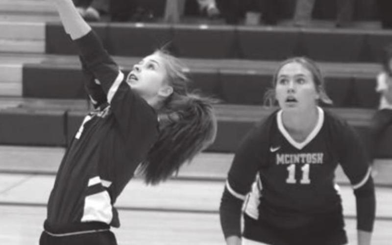 RIGHT: McIntosh’s Carlie Lafferty and Chloe Sandland play defense versus Timber Lake.