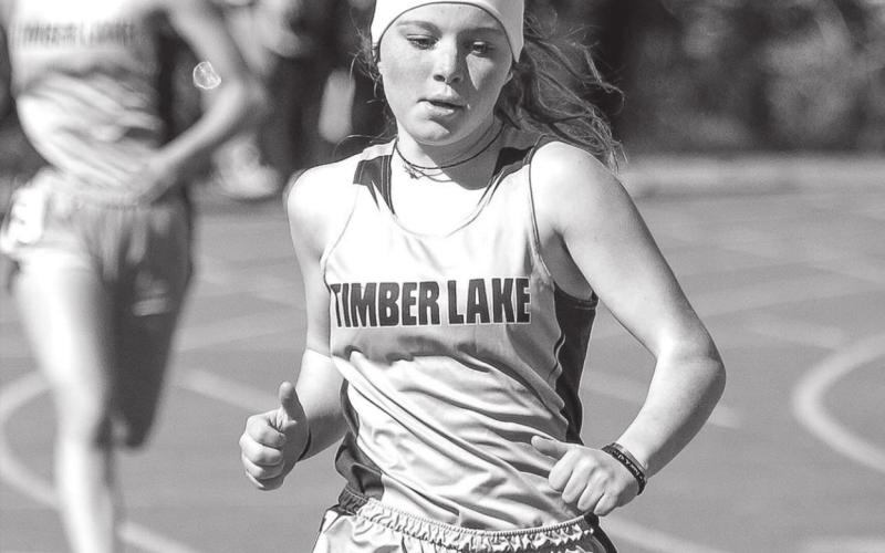Timber Lake’s Kenlea Heck runs in the 400 meter race at TL’s early track meet File photos by Jon Flatland