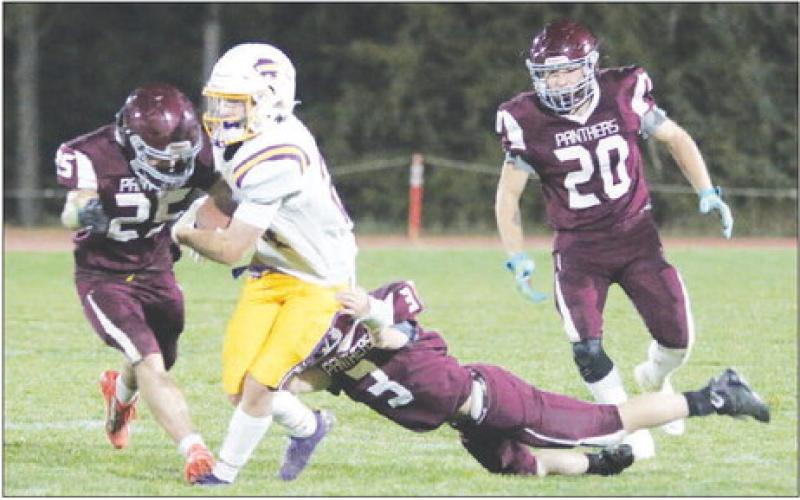 Timber Lake’s Caleb Bieber (25) and Holden Gill (3) combine to take down a Stanley County runner while Thane Keller (20) moves in to assist during the Panthers overtime win over the Buffaloes last Friday, Sept. 30. Photo by Jon Flatland