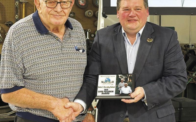 Bob Schuh (left) and his wife Dorothy of Isabel were recipients of the 2025 Good Neighbor award, presented by Ryan Maher, chairman of the Moreau-Grand board. Dorothy was unable to attend as she was recovering from surgery.