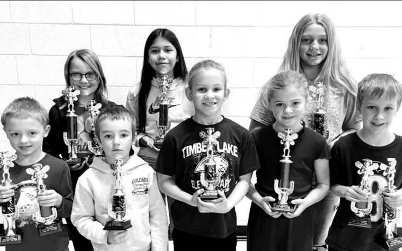 ABOVE: TIMBER LAKE ELEMENTARY TROPHY WINNERS. (FRONT) L-R: Benjamin Mareska, Camden Goldade, Brynn Lemburg, Alexa Roggow, Mason Hollenbeck; BACK: Maya Biegler, Autym Red Bear, Madalyn Hermes. Photos by Kathy Nelson