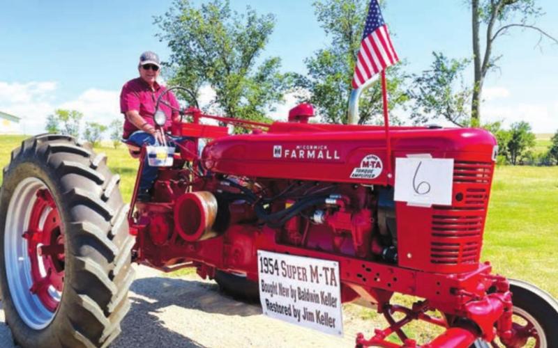 Jim Keller (driving)restored this 1954 Super M-TA that Baldwin Keller purchased new at Hulm Chevrolet.