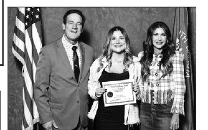 Kenna Webb of Timber Lake High School received a certificate from Gov. Kristi Noem (RIGHT) and Lt. Gov. Larry Rhoden at the Academic Excellence Recognition Luncheon.