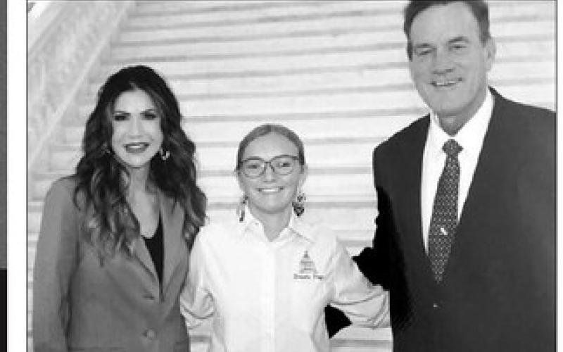 Kathryn Volk (MIDDLE) was honored at the Associated School Boards of South Dakota Academic Excellence Luncheon as the top senior from the McIntosh Class of 2023. She is pictured here with Gov. Kristi Noem (LEFT) and Lt. Gov. Larry Rhoden earlier this year when she served as a page in the South Dakota Senate.