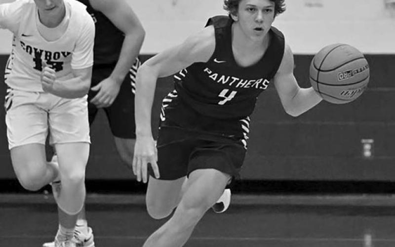 Panther guard Broc Bauer pushes the ball upcourt on a fast-break during varsity boys hoops action. Bauer poured in a game-high 22 points to lead the Timber Lake JV squad over Mobridge-Pollock. Topic photo by Marie DuPreez