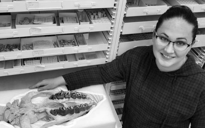 Mindy Householder with a Subhyracodon (Rhino) fossil that was found in western North Dakota. “It was one of the first things I prepped when we moved to North Dakota so I'm rather fond of it,” she said.