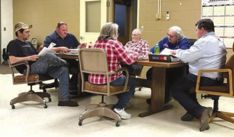 Members of the town of Isabel’s Board of Trustees discuss an estimated $2.1 million wastewater infrastructure improvement project on Monday, May 15. Members include, L-R, Clint Doan, Vice-President Daryl Pfaff, Judy Gifford, Darrel Burke, Finance Officer Karla Nordyke, and President Ryan Maher. Photo by Jon Flatland
