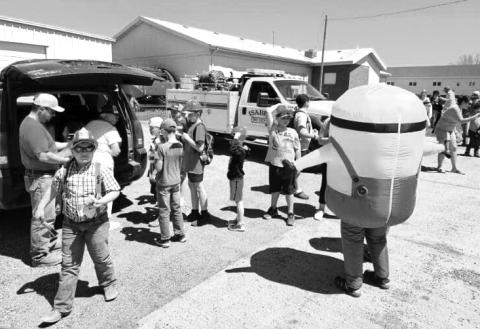 The Isabel Future Visions group and the Isabel Fire Department teamed up to give Isabel kids ice cream treats as they exited the school bus in Isabel on the final day of the school year last Friday, May 17. The kids were given tours of the fire trucks and equipment and entertained by a giant Minion. Submitted Photo