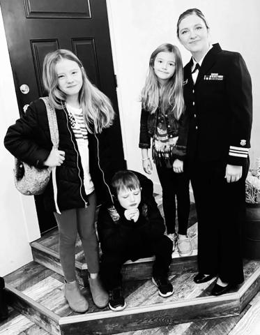 Lt. Commander Veronica Handeland of Timber Lake with her children (L-R) Ella, Liam and Lily on Veterans Day.