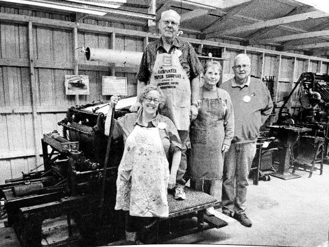 Standing with the 1895 Babcock cylinder press at the South Central Threshing Association’s historic print shop at Braddock, ND, are left to right, Prof. Lucy Ganje of the University of North Dakota, Grand Forks, Art and Lois Heinrich of Box Elder, and Roger Bailey, Executive Director of the North Dakota Newspaper Association, Bismarck, ND.