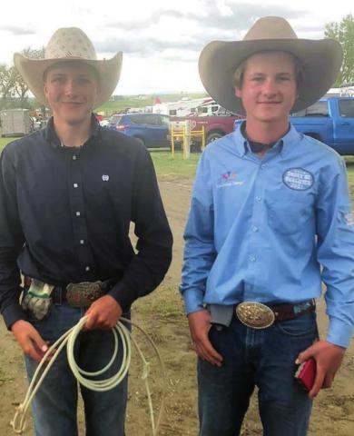 Sage Burress (L) and Rope Roghair of Isabel team roped at the region high school rodeo and also competed individually. Courtesy Photo