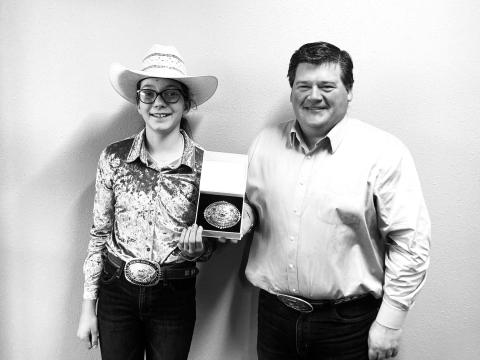 Ryan Maher of The Occidental General Store at Isabel (RIGHT) presents the SD Quarterhorse Assn. buckle for the top three-year-old out-of-state earner to Bricelyn Pederson, owner of BHR The Bomb Dot Com.