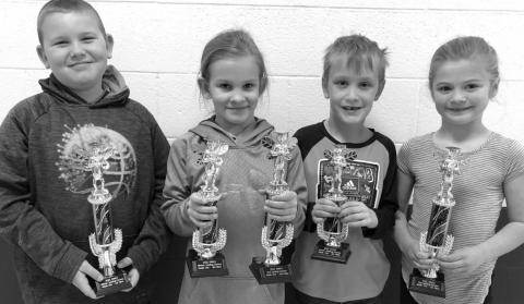 Timber Lake first and second grade trophy winners are (L-R): Brayden Meier, 1st in written; Brynn Lemburg, 2nd in oral and 3rd in written; Mason Hollenbeck, 4th in written; and Alexa Roggow, 1st in oral.