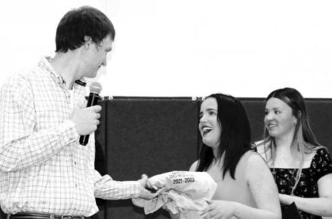 Shayna Farlee receiving her Most Improved in Basketball award from coach Clint Holmes.