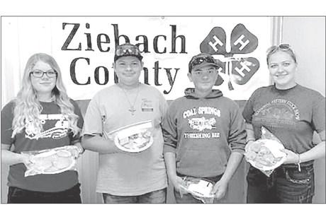 Winners of the Ziebach County Cookie Contest were (L-R) Trinity Leithauser, first place; Wyatt Lemke and Maverick Lemke, tied for second place; and Erin Lemke, third place. Gail Stambach and Bev Birkeland were the judges.