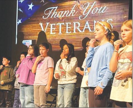 Fifth graders performed “God Bless America” in sign language at the Timber Lake Elementary School Veterans Day program on November 10. L-R are Glen Mowrer, John Bigger, Lilly Goodine, Kyren Ley, Marley Ward, Luke Beer, Alexa Roggow, and Lily Handeland. Each third, fourth and fifth grade class performed. Photo by Kathy Nelson