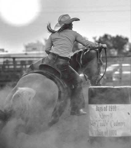 Sydney Maher, Timber Lake, rounds a barrel with the sun setting over Timber Lake during the Days of 1910 rodeo. Maher has been cashing in at recent SDRA events.
